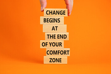 Out from comfort zone symbol. Wooden blocks with words Change begins at the end of your comfort...
