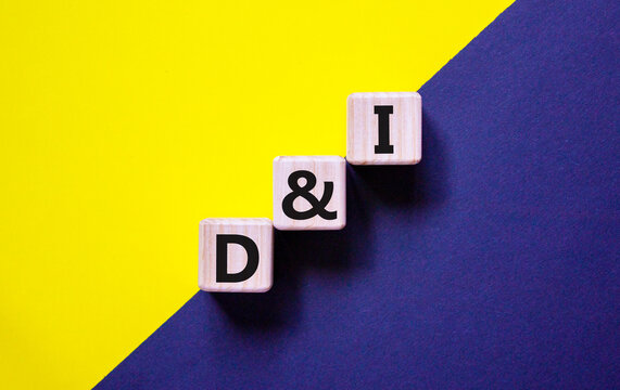 D and I, Diversity and inclusion symbol. Concept words D and I, diversity and inclusion on wooden cubes on beautiful blue background. Business, D and I, diversity and inclusion concept.