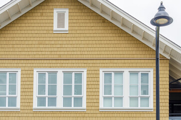 The top of the house or apartment building with nice window.