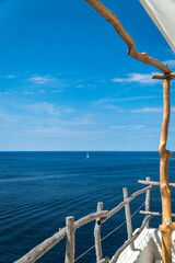 Wood railing with ocean views in Alaior, Menorca (Spain).
