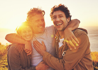 Friends uplift the soul. Portrait of three friends standing on a hill top at sunset.