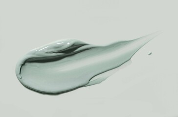 Smudge swatch kaolin clay cosmetic gel or mask blue green background isolated
