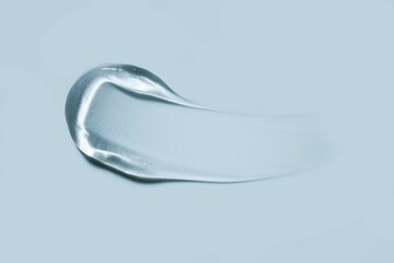 Liquid gel cosmetic smudge drops texture blue grey background 