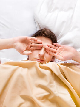 Tired Young Man in the Bed