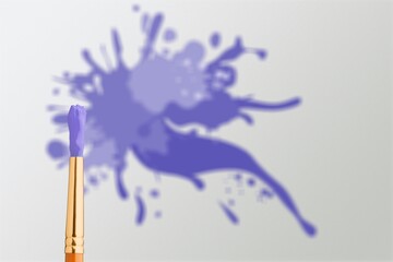 Process of choosing paint for the walls during house renovation, color and brush in paint, color of the year 2022