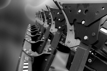 The image of the cultivator of the soil in the transport position. Plough. Harrow. Fragment. The...