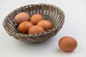 Closeup of fresh brown eggs in Easter basket