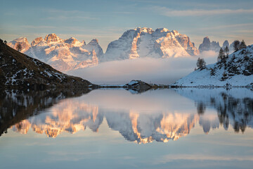 Brenta Dolomites reflected in the Ritorto lake at sunset, Adamello Brenta Natural Park, Trentino, Italy.