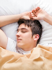 Obraz na płótnie Canvas Young Man sleeping