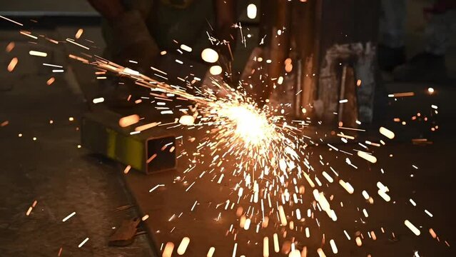 sparks from a metal grinder in slow motion