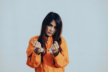 Prisoner in orange robe concept,Portrait of asian woman in Prison uniforms on white background,