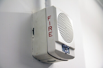 Close up of a fire detector and alarm in an industrial environment