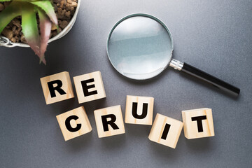 Recruit word and magnifying glass