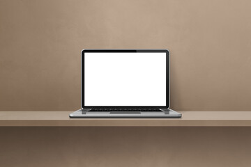 Laptop computer on brown shelf background