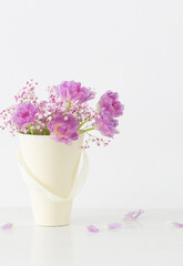 bouquet of pink tulips and gypsophila on white table