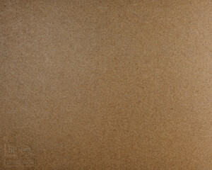 Fototapeta na wymiar surface of paperboard made from recycled brown fibers with embossed logos