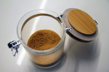 Close up of a isolated glass and wood cane sugar jar