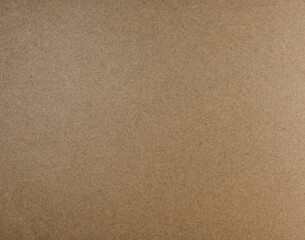 Fototapeta na wymiar surface of paperboard made from brown fibers