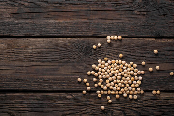 Dry grains of peas scattered on the table.