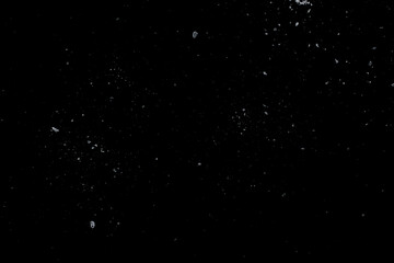 Sea salt crystals on a black surface.