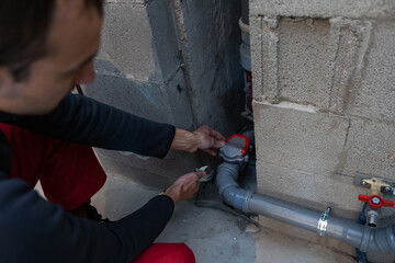 Plumber man with tools. Plumbing and renovation.