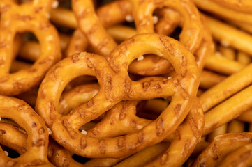 Crispy bread straws with salt, close-up, selective focus, top view.