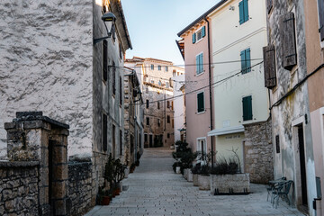 Narrow, beautiful streets of istrian town of Bale, Croatia with dense built, colorful houses with wooden window shutters