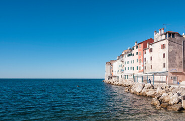Beautiful, coastal town of Rovinj, Croatia famous for its colorful houses built right above the adriatic sea on the rocky shore