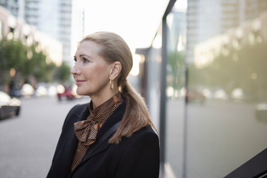 Portrait of businesswoman on city street
