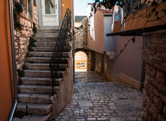 Fototapeta premium Beautiful Rovinj steep, narrow streets with stone arches and medieval walls