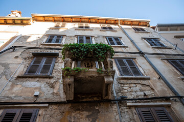Beautiful, old houses with aged facades and architectural elements native to istrian peninsula and...