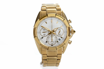 golden women's wrist watch with diamonds and a metal bracelet and chronograph isolated on a white background close-up. Expensive and rich gift for women.