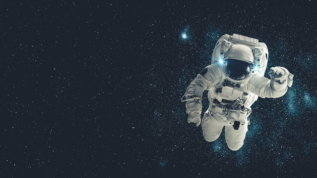 Astronaut spaceman do spacewalk while working for spaceflight mission at space station . Astronaut wear full spacesuit for operation . Elements of this image furnished by NASA space astronaut photos . - Powered by Adobe