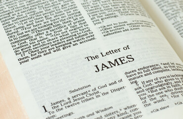 Apostle James epistle letter open Holy Bible Book close-up. New Testament Scripture. Studying the...