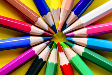 Fototapeta premium Colored Pencils On A Yellow Background. Education