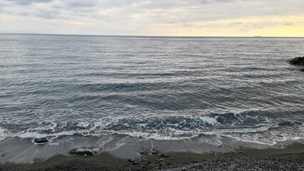 Genova, Italy - January 12, 2022 - Seascape, blue sky, clouds and sea in the tropical waters of the Mediterranean sea in winter days.