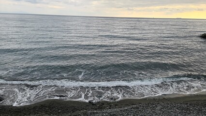 Genova, Italy - January 12, 2022 - Seascape, blue sky, clouds and sea in the tropical waters of the Mediterranean sea in winter days.