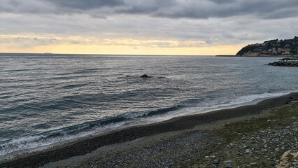 Genova, Italy - January 12, 2022 - Seascape, blue sky, clouds and sea in the tropical waters of the Mediterranean sea in winter days.