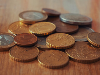 A lot of euro cents of different denominations, a close-up shot.