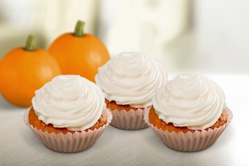 Muffins with pumpkin. Delicious homemade dessert. Halloween treats. Vegetarian dish.