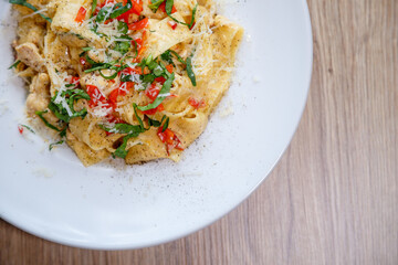 pappardelle pasta with chicken breast and red pepper detail