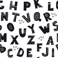 Fototapeta premium A seamless pattern of letters of the alphabet. Vector print for packaging, paper, children's textiles and home decor