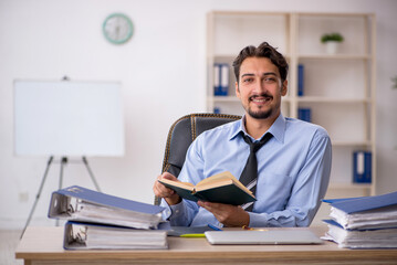 Young male employee working in the office