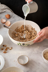 Cooking cookies, healthy oats and nut homemade biscuits.