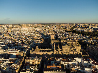 Fototapeta premium Dramatic aeria view of the Sevilla cathedral in Seville old town with it famous Giralda bell town in Andalucia in Spain