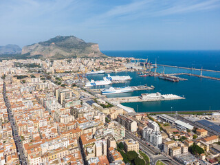 Aerial view of GNV ferry boats that are anchored at the Palermo harbor in the largest city in Sicily by the Mediterranean sea.