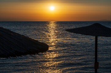 Tranquil scene of beautiful sea at sunset. Orange and yellow sunset on the sea. Aerial panoramic...