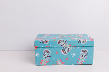 Blue gift box on white background, side view