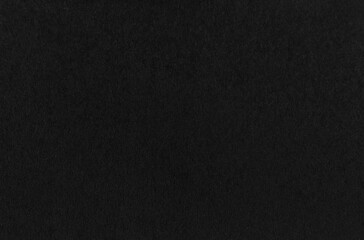 Black paper or cardboard texture as background