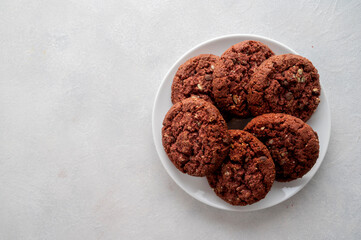 Oatmeal red velvet cookies nuts and seeds on bright background. Top view.